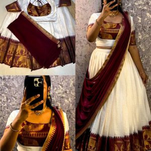 Launching white lehenga with wine zari border suitable for your onam festival