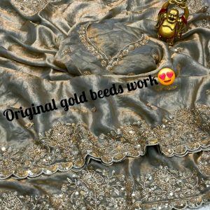 Launch Grand party wear saree in original gold beeds work