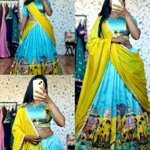 Sky-blue art-inspired lehenga with a hand-painted look and a storytelling border, giving it a unique traditional charm.
Paired with a flowy yellow dupatta finished with subtle shimmer lace for an elegant festive touch ✨