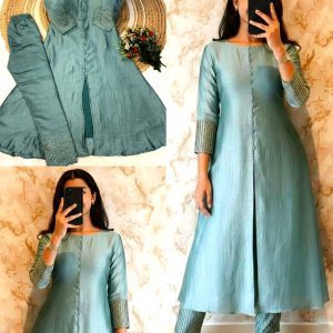 Crafted in luxurious blooming this elegant A-line kurta set is adorned with beautiful sleeve and pant handwork this work highlight rich look of the outfit